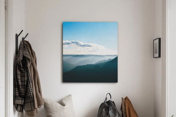 Custom canvas prints hanging in home entryway